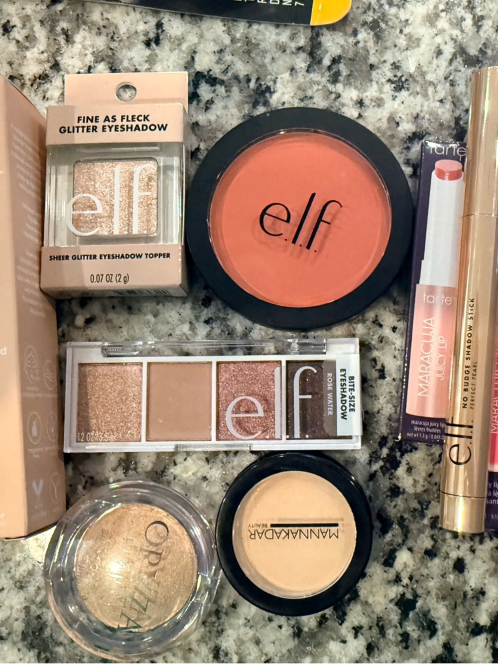 Lot of eyeshadows, blush, and Tarte lip colors